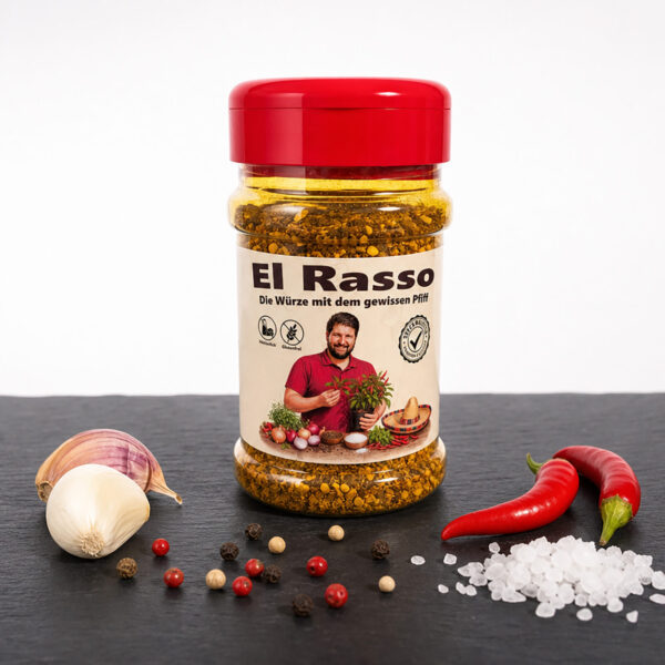 El Rasso Gewürzdose mit Chili, Knoblauch, Pfefferkörnern und Salz auf dunkler Fläche.