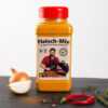 Fleisch‑Mix Gewürzdose mit Chili, Zwiebel, Pfefferkörnern und Thymian auf dunkler Fläche.